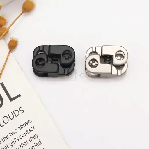 Dual-Hole Cord Stopper With Exposed Spring Mechanism