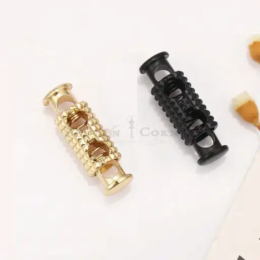 Dual-Hole Cord Stopper With Cross-Cut Pattern 